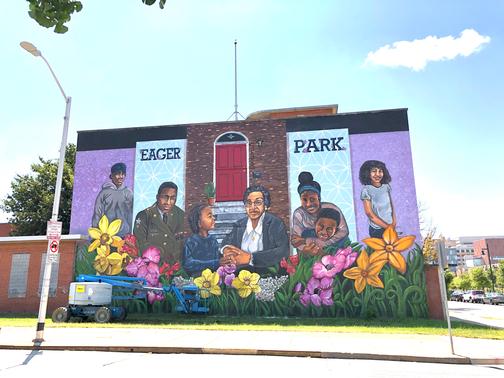 The mural conveys typical historic East Baltimore rowhome features, including bright marble stairs, a transom window, and the distinctive brick façade, with subtle themes throughout that uniquely connect back to East Baltimore. Additionally, the mural includes portraits of past, present, and future leaders Darrian Alexander, Randolph Scott, SirKaeden Carr, Delegate Hattie Harrison, Latisha Jackson and her son Daryll Thames and Sol Aloe.
